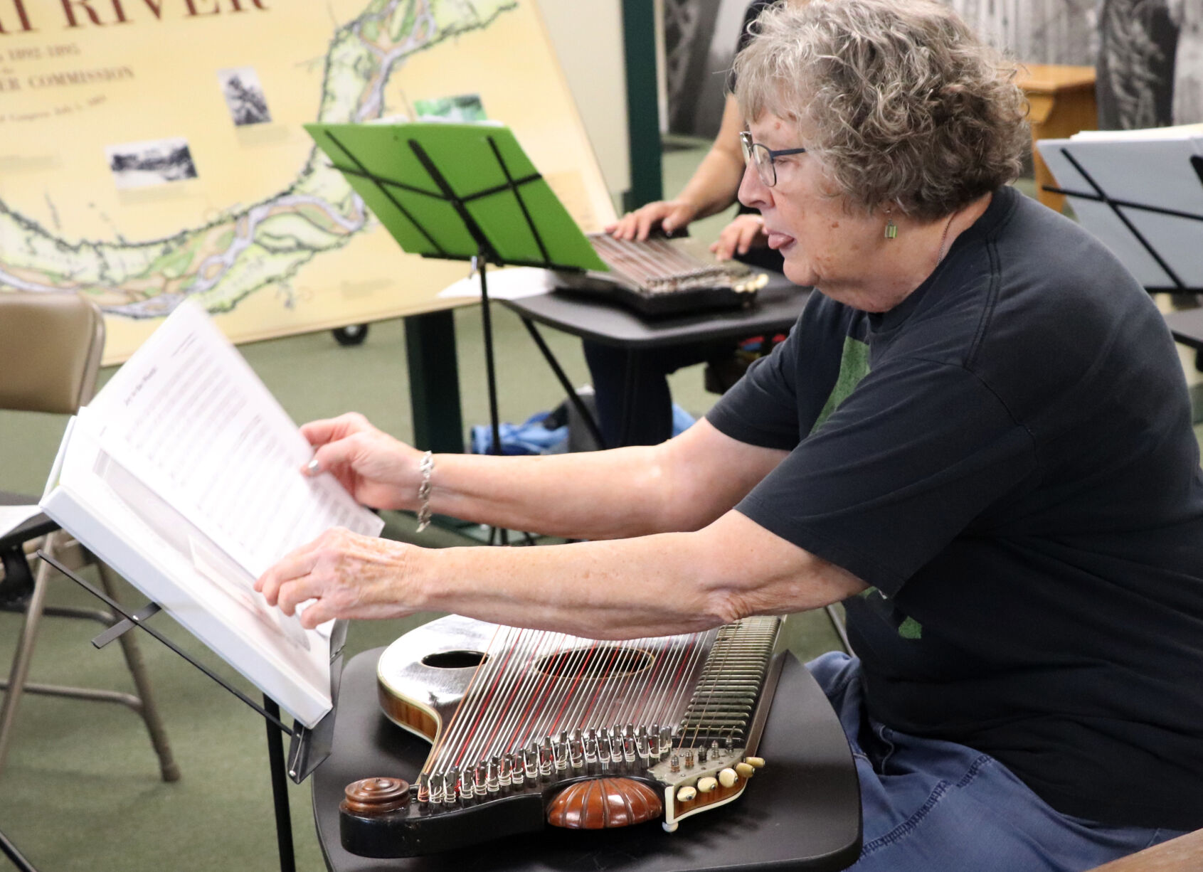Debbie Bandy flips through sheet music